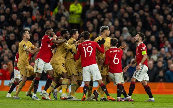 (230224) -- MANCHESTER, Feb. 24, 2023 -- Manchester United, ManU s Bruno Fernandes (1st, R) clashes with Barcelona players during the UEFA Europa League play-off 2nd leg match between Manchester United and Barcelona in Manchester, Britain, Feb. 23, 2023. (SP)BRITAIN-MANCHESTER-FOOTBALL-UEFA EUROPA LEAGUE-MANCHESTER UNITED VS BARCELONA LixYing 