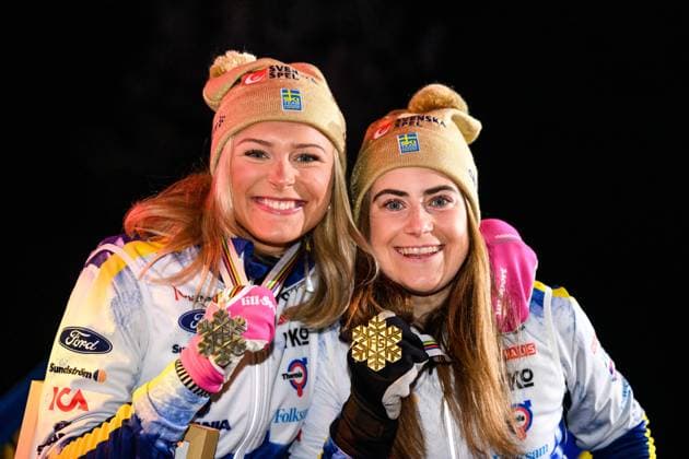 230225 Silver medalist Frida Karlsson and Gold medalist Ebba Andersson pose their medals at the Medal ceremony for the women?s cross country skiing skiathlon during the FIS Nordic Ski World Championships on February 25, 2023 in Kranjska Gora Photo Petter Arvidson PHOTO AGENCY code PA PA0521 ski cross country skiing cross-country ski world championships 2023 fis nordic ski world championships bbeng fis nordic world ski championships wm ski wm medal ceremony medal ceremony cheers,  Copyright: PETTERxARVIDSON BB230225PA165
