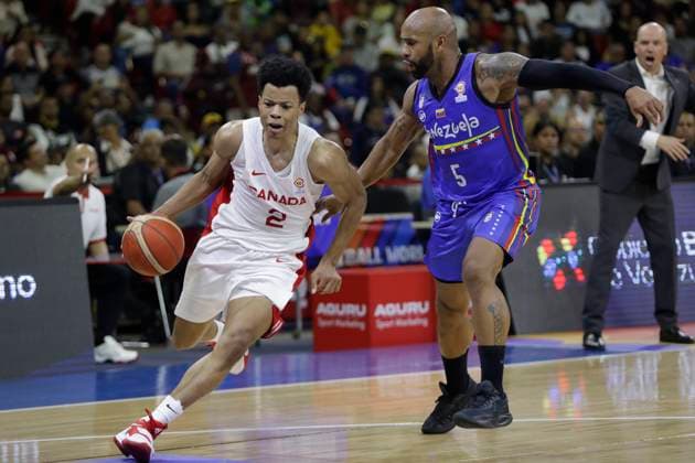 February 26, 2023, Caracas, Caracas Venezuela, Venezuela: CARACAS, VENEZUELA - FEBRUARY 26: Trae Bell-Haynes of Canada drives the ball against Gregory Vargas of Venezuela during the Americas qualifiers for the FIBA Ã¢â‚¬¹Ã¢â‚¬¹Basketball World Cup 2023 basketball game, at Poliedro de Caracas, in Caracas, Venezuela, on February 26, 2023. Caracas Venezuela - ZUMAp175 20230226_zsa_p175_029 Copyright: xPedroxRancesxMatteyx