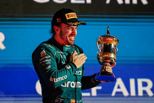 ALONSO Fernando (spa), Aston Martin F1 Team AMR23, portrait celebrates with the trophy at the podium during the Formula 1 Gulf Air Bahrain Grand Prix 2023, 1st round of the 2023 FIA Formula One World Championship, WM, Weltmeisterschaft from March 2 to 5, 2023 on the Bahrain International Circuit, in Sakhir, Bahrain - F1 - BAHRAIN GRAND PRIX 2023 - RACE DPPI Panoramic  00123003__R3_2221