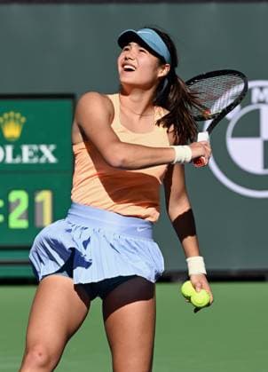 INDIAN WELLS, CA - MARCH 09: Emma Raducanu of Great Britain looks up after hitting an autographed ball into the stands after winning a tennis match and moving onto the next round of the BNP Paribas Open played on March 9, 2023 at the Indian Wells Tennis Garden in Indian Wells, CA.(Photo by John Cordes Icon Sportswire) TENNIS: MAR 09 BNP Paribas Open Icon506230309065