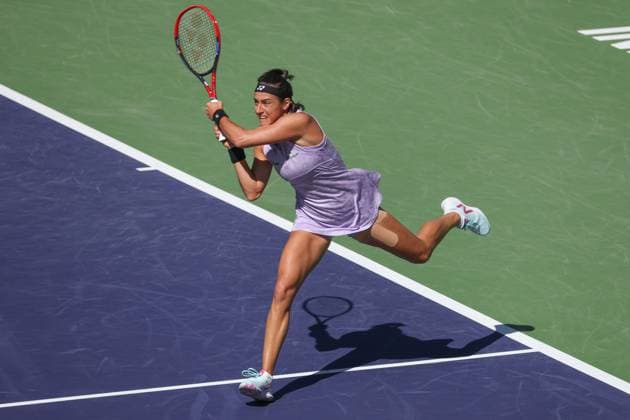 INDIAN WELLS, CA - MARCH 13: Caroline Garcia (FRA) hits a backhand during the BNP Paribas Open on March 13, 2023 at the Indian Wells Tennis Garden in Indian Wells, CA. (Photo by George Walker Icon Sportswire) TENNIS: MAR 13 BNP Paribas Open Icon230313001