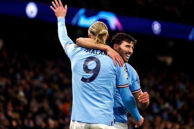 Football - 2022 2023 UEFA Champions League - Round of Sixteen - Second Leg - Manchester City vs RB Leipzig - Etihad Stadium - Tuesday 14th March 2023. Erling Haaland of Manchester City celebrates with Ruben Dias after he scores his fifth goal of the game to put City 5-0 up, at the Etihad. 