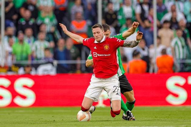 Real Betis v Manchester United, ManU Europa League 16 03 2023. Wout Weghorst (27) of Manchester United is brought down by Guido Rodriguez (5) of Real Betis during the Europa League match between Real Betis and Manchester United at Estadio Benito Villamarin, Seville, Spain on 16 March 2023. Editorial use only , Copyright: xNigelxKeenex PSI-17076-0028