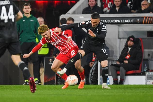 Football Europa League Round of 16 second leg 22 23 SC Freiburg vs Juventus Turin 16 03 2023 Ritsu Doan SC Freiburg 42 in duel with Filip Kostic Juventus Turin 17 Football Europa League Round of 16 second leg SC Freiburg vs Juventus Turin on Thursday, March 16, 2023 at Europa Park Stadium in Freiburg im Breisgau, Germany Copyright: xBEAUTIFULxSPORTS GerdxGruendlx