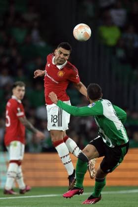 Seville, Spain, 16th March 2023. Casemiro of Manchester United, ManU heads clear from Rodri of Real Betis during the UEFA Europa League match at Estadio Benito Villamarin, Seville. Picture credit should read: Jonathan Moscrop Sportimage EDITORIAL USE ONLY. No use with unauthorised audio, video, data, fixture lists, club league logos or live services. Online in-match use limited to 120 images, no video emulation. No use in betting, games or single club league player publications. SPI-2301-0047