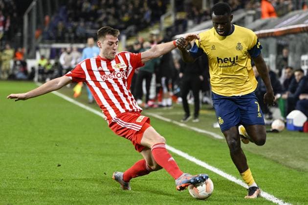 Berlin s Robin Knoche and Union s Victor Boniface fight for the ball during a soccer game between Belgian Royale Union Saint-Gilloise and German Union Berlin, Thursday 16 March 2023 in Anderlecht, Brussels, the return leg of the round of 16 of the UEFA Europa League competition, after a 3-3 draw result at the first leg. LAURIExDIEFFEMBACQ  x63148679x