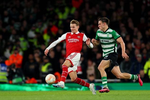 16th March 2023; Emirates Stadium, London, England; Europa League Football, Round of 16, Second Leg, Arsenal versus Sporting Lisbon; Martin Odegaard of Arsenal is under pressure from Manuel Ugarte of Sporting Lisbon  ActionPlus12487436 ShaunxBrooks
