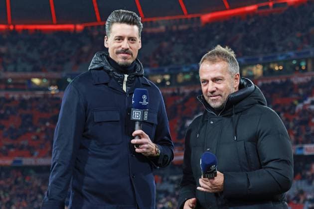 German coach, Hans Dieter Hansi Flick, and TV expert, co-commentator, Sandro Wagner, DAZN, portraet, portrait, interview, football UEFA Champions League FC Bayern Muenchen Paris Saint Germain Allianz Arena 08 03 2023 PHOTO Mladen Lackovic LakoPress