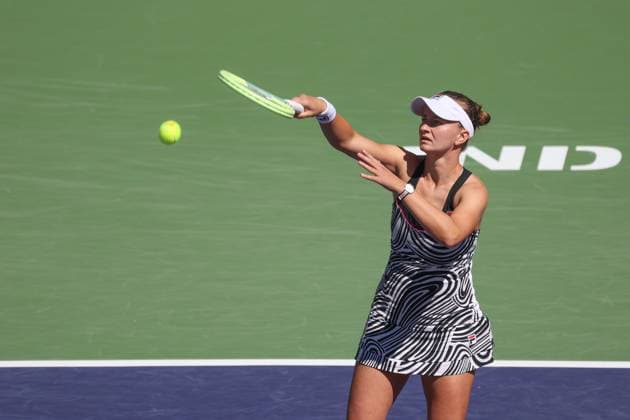 INDIAN WELLS, CA - MARCH 18: Barbora Krejcikova (CZE) hits an overhead during the BNP Paribas Open on March 18, 2023 at the Indian Wells Tennis Garden in Indian Wells, CA. (Photo by George Walker Icon Sportswire) TENNIS: MAR 18 BNP Paribas Open Icon230318009