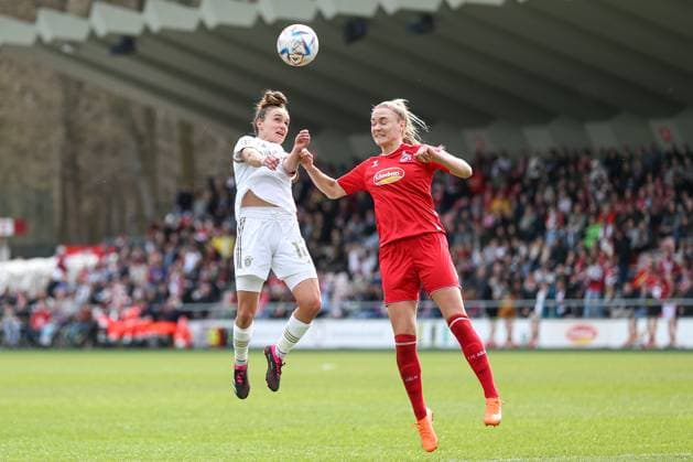 Cologne, Germany, 18 03 2023 Lina Magull FC Bayern Munich and Sarah Puntigam 1 FC Cologne in a duel , during the match of the Flyeralarm Frauenbundesliga between 1 FC Cologne and FC Bayern Munich at Franz Kremer Stadium on 18 March 2023 in Cologne Cologne Franz Kremer Stadium North Rhine Westphalia Germany Copyright: xOliverxKaelkex