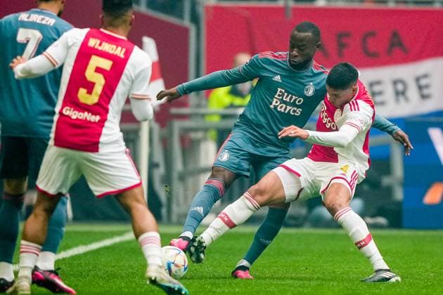 Eredivisie: Ajax v Feyenoord Amsterdam - Lutsharel Geertruida of Feyenoord, Edson Alvarez of Ajax during the match between Ajax v Feyenoord at Johan Cruyff Arena on 19 March 2023 in Amsterdam, Netherlands. Copyright: xTomxBodex