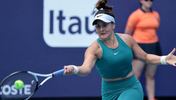 Bianca Andreescu from Canada returns a ball to Emma Raducanu from Great Britain in the third set on opening day of the Miami Open in the Hard Rock Stadium in Miami Gardens, Florida, on Wednesday, March 22, 2023. Andreescu defeated Raducanu 6-3, 3-6, 6-2.  MIA20230322115 GARYxIxROTHSTEIN