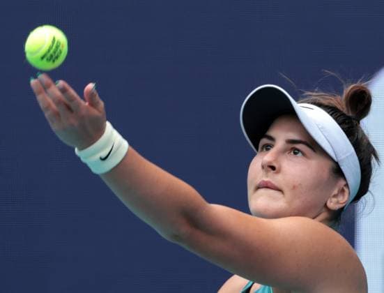 Bianca Andreescu from Canada serves to Emma Raducanu from Great Britain in the first set on opening day of the Miami Open in the Hard Rock Stadium in Miami Gardens, Florida, on Wednesday, March 22, 2023.  MIA20230322107 GARYxIxROTHSTEIN