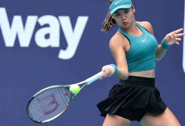 Emma Raducanu from Great Britain returns the ball to Bianca Andreescu from Canada in the third set on opening day of the Miami Open in the Hard Rock Stadium in Miami Gardens, Florida, on Wednesday, March 22, 2023.  MIA20230322116A GARYxIxROTHSTEIN