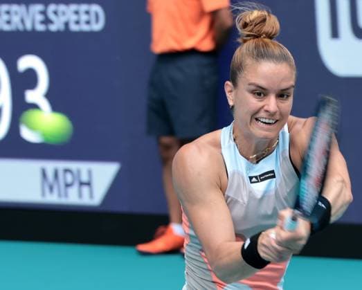 Maria Sakkara from Greece hits a backhand shot back to Bianca Andreescu from Canada during day three at the Miami Open in the Hard Rock Stadium in Miami Gardens, Florida, on Friday, March 24, 2023. Andreescu defeated Sakkara 7-7,6-3,6-4.  MIA20230324102 GARYxIxROTHSTEIN