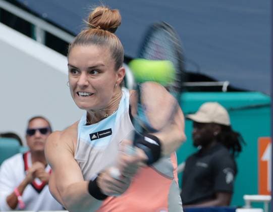 Maria Sakkara from Greece hits a backhand shot to Bianca Andreescu from Canada during day three at the Miami Open in the Hard Rock Stadium in Miami Gardens, Florida, on Friday, March 24, 2023. Andreescu defeated Sakkara 7-7,6-3,6-4.  MIA20230324113 GARYxIxROTHSTEIN