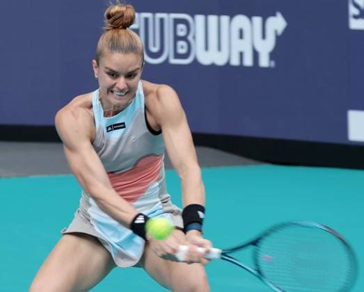 Maria Sakkara from Greece hits a backhand shot to Bianca Andreescu from Canada during day three at the Miami Open in the Hard Rock Stadium in Miami Gardens, Florida, on Friday, March 24, 2023. Andreescu defeated Sakkara 7-7,6-3,6-4.  MIA202303241031 GARYxIxROTHSTEIN