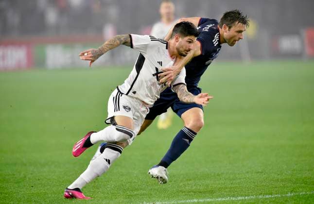 WASHINGTON, DC - MARCH 25: New England Revolution defender Dave Romney (2) defends DC United midfielder Taxiarchis Taxi Fountas (11) during the New England Revolution versus D.C. United Major League Soccer MLS, Fussball Herren, USA game on March 25, 2023 at Audi Field in Washington, D.C.. (Photo by Randy Litzinger Icon Sportswire) SOCCER: MAR 25 MLS - D.C. United vs New England Revolution Icon9662303250704