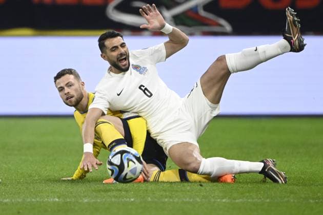 STOCKHOLM 20230327 Swedens Gabriel Gudmundsson tv and Azerbaijans Hojjat Haggverdi during Mondays European Championship qualifying football match between Sweden and Azerbaijan at Friends Arena STOCKHOLM SWEDEN x10080x,  Copyright: xFredrikxSandberg TTx EM-KVAL SVERIGE-AZERBAJDZJAN