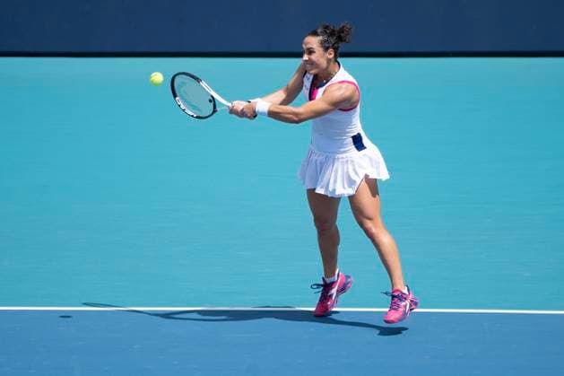 March 27, 2023, Miami Gardens, Florida, United States: March, 27 - Miami Gardens: Martina Trevisan of Italy plays Jelena Ostapenko of Latvia during the round of 16 at the 2023 Miami Open by Itau. Miami Gardens USA - ZUMApa3_ 20230327_zap_pa3_013 Copyright: xAndrewxPatronx