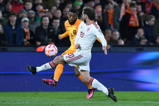 Soccer UEFA European Qualifiers Netherlands Gibraltar on 27 03 2023 at Feyenoord Stadium in Rotterdam Georgino Wijnaldum Netherlands , back Ethan Britto Gibraltar , front xRx