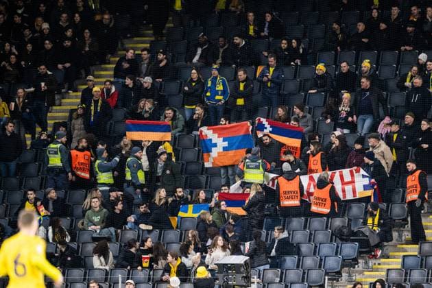 230327 Security guards in the stands with fans holding up a protest banner during the UEFA Euro Qualifier football match between Sweden and Azerbaijan on March 27, 2023 in Stockholm Photo Jesper Zerman BILDBYRAN COP 234 JZ0347 bbeng football soccer fotbol fotball uefa euro qualifier landskamp emkval em kvalifisering em kvalik sweden sweden a sweden azerbaijan audience,  Copyright: JESPERxZERMAN BB230327JZ037