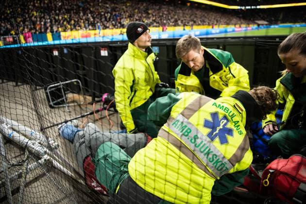 230327 A photographer is injured during the UEFA Euro Qualifier football match between Sweden and Azerbaijan on March 27, 2023 in Stockholm.,  Copyright: JESPERxZERMAN BB230327JZ042