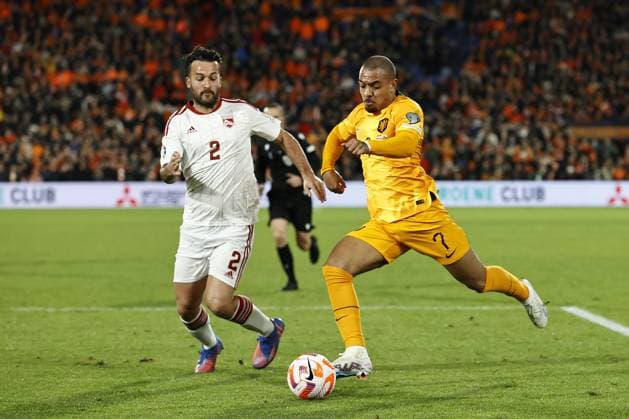ROTTERDAM - (l-r) Ethan Jolley of Gibraltar, Donyell Malen of Holland during the UEFA European Championship, EM, Europameisterschaft Qualifying match between the Netherlands and Gibraltar at Feyenoord Stadion de Kuip on March 27, 2023 in Rotterdam, Netherlands. ANP MAURICE VAN STONE UEFA EURO, EM, Europameisterschaft,Fussball 2024 Qualifying Round 2022 2023 xVIxANPxSportx xxANPxIVx 465883924 originalFilename: 465883924.jpg