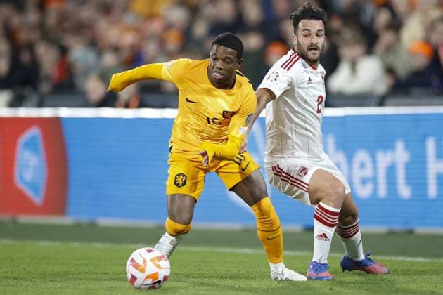 ROTTERDAM , 27-03-2023 , Stadion de Kuip , UEFA Qualification EURO 2024 , season 2022 2023 , match between Netherlands and Gibraltar , (L-R) Netherlands player Tyrell Malacia, Gibraltar player Ethan Jolley Netherlands - Gibraltar  x20346893x Copyright: