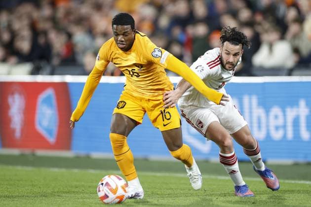 ROTTERDAM , 27-03-2023 , Stadion de Kuip , UEFA Qualification EURO 2024 , season 2022 2023 , match between Netherlands and Gibraltar , (L-R) Netherlands player Tyrell Malacia, Gibraltar player Ethan Jolley Netherlands - Gibraltar  x20346897x Copyright:
