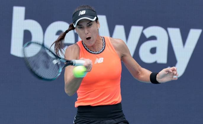 Unranked Sorana Cirstea from Romania returns a forehand shot to No. 2 in the world Aryna Sabalenka from Belarus in the quarter-final match at the Miami Open in the Hard Rock Stadium in Miami Gardens, Florida, on Wednesday, March 29, 2023. Cirstea upset Sabalenka 6-4, 6-4.  MIA20230329111 GARYxIxROTHSTEIN