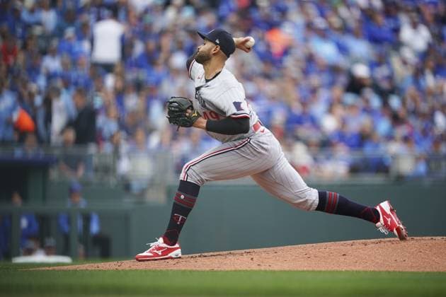 Minnesota Twins starting pitcher Pablo Lopez (49) pitches against the Kansas City Royals during the first inning on Opening Day at Kauffman Stadium in Kansas City, Missouri on Thursday, March 30, 2023.  KCP20230330107 KYLExRIVAS