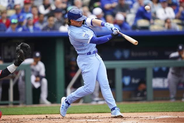 Kansas City Royals shortstop Bobby Witt Jr. (7) hits a Minnesota Twins pitch during the first inning on the Opening Day at Kauffman Stadium in Kansas City, Missouri on Thursday, March 30, 2023.  KCP20230330109 KYLExRIVAS