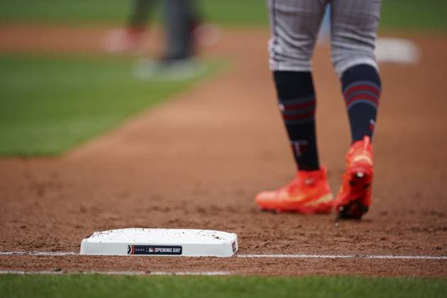 Opening Day signage appears on the bases before the Minnesota Twins take on the Kansas City Royals at Kauffman Stadium in Kansas City, Missouri on Thursday, March 30, 2023.  KCP20230330104 KYLExRIVAS