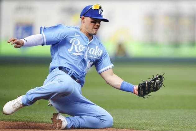 Kansas City Royals second baseman Michael Massey (19) snags a Minnesota Twins ground ball during the fourth inning on Opening Day at Kauffman Stadium in Kansas City, Missouri on Thursday, March 30, 2023.  KCP20230330113 KYLExRIVAS