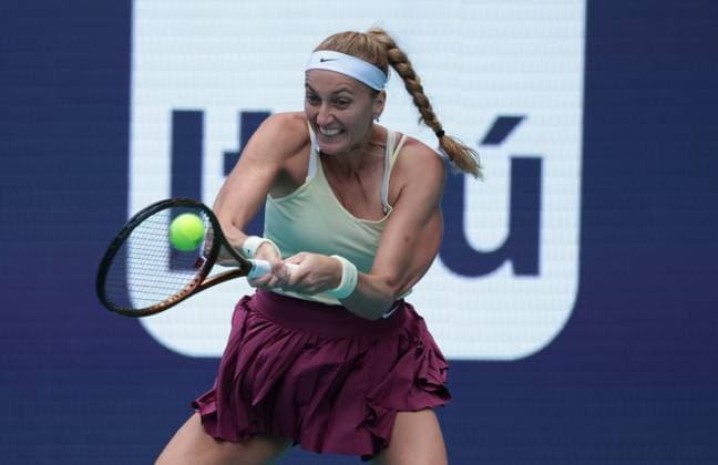 Petra Kvitova from the Czech Republic hits a two handed backhand to Sorana Cirstea from Romania in the womens semi-final match on the stadium court at the Miami Open in the Hard Rock Stadium in Miami Gardens, Florida, on Friday, March 31, 2023. Kvitova defeated Cirstea 7-5,6-4 to advance to the finals.  MIA20230331206 GARYxIxROTHSTEIN