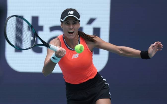 Sorana Cirstea from Romania hits a forehand shot to Petra Kvitova from the Czech Republic in the women s semi-final match on the stadium court at the Miami Open in the Hard Rock Stadium in Miami Gardens, Florida, on Friday, March 31, 2023. Kvitova defeated Cirstea 7-5,6-4 to advance to the finals.  MIA20230331212 GARYxIxROTHSTEIN