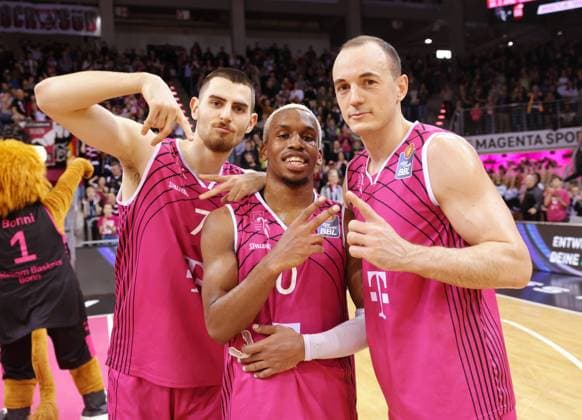 After the win Sebastian Herrera, TJ Shorts II, Karsten Tadda Telekom Baskets Bonn vs Yoeli Childs Veolia Towers Hamburg Photo Jörn Wolter