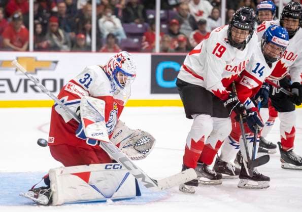 April 7, 2023, BRAMPTON, ON, CANADA: Canada forward Brianne Jenner (19) and Czechia defender Dominika Laskova (14) watch as Czechia goaltender Blanka Skodova (31) makes a save during third period IIHF WomenöÄÃ s World Hockey Championship hockey action in Brampton, Ont., on Friday, April 7, 2023. Canada News - April 7, 2023  - ZUMAc35_ 20230407_zaf_c35_135 Copyright: xFrankxGunnx