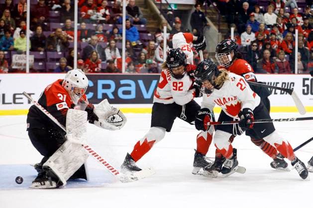 April 8, 2023, BRAMPTON, ON, CANADA: A puck slips through the legs of Japan goaltender Riko Kawaguchi (31) as Canada forward Danielle Serdachny (92), forward Emma Maltais (27) and Japan defender Aoi Shiga (3) battle in front of the net during second period IIHF Womens World Hockey Championship hockey action in Brampton, Ont., on Saturday, April 8, 2023. Canada News - April 8, 2023  - ZUMAc35_ 20230408_zaf_c35_066 Copyright: xColexBurstonx
