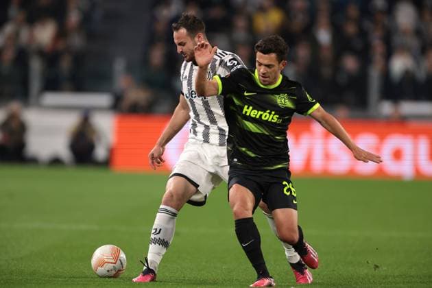 Turin, Italy, 13th April 2023. Pedro Goncalves of Sporting CP tussles with Federico Gatti of Juventus during the UEFA Europa League match at Allianz Stadium, Turin. Picture credit should read: Jonathan Moscrop Sportimage EDITORIAL USE ONLY. No use with unauthorised audio, video, data, fixture lists, club league logos or live services. Online in-match use limited to 120 images, no video emulation. No use in betting, games or single club league player publications. SPI-2362-0001