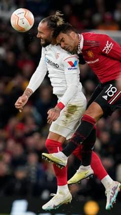 Manchester, England, 13th April 2023. Nemanja Gudelj of Sevilla tussles with Casemiro of Manchester United, ManU during the UEFA Europa League match at Old Trafford, Manchester. Picture credit should read: Andrew Yates Sportimage EDITORIAL USE ONLY. No use with unauthorised audio, video, data, fixture lists, club league logos or live services. Online in-match use limited to 120 images, no video emulation. No use in betting, games or single club league player publications. SPI-2367-0031