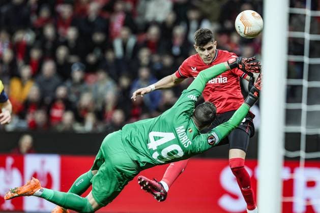 Union s goalkeeper Anthony Moris and Leverkusen s Piero Hincapie fight for the ball during a soccer game between German Bayer 04 Leverkusen and Belgian Royale Union Saint-Gilloise, the first leg game of the quarterfinals of the UEFA Europa League competition, Thursday 13 April 2023 in Leverkusen, Germany. BRUNOxFAHY  x64674141x