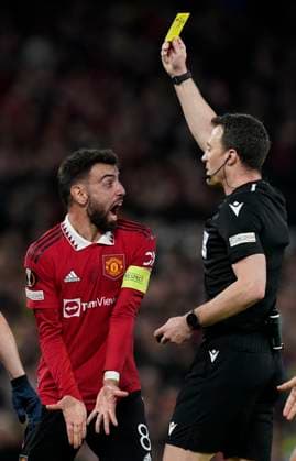 Manchester, England, 13th April 2023. Bruno Fernandes of Manchester United, ManU reacts to a yellow card which means he will miss the 2nd leg during the UEFA Europa League match at Old Trafford, Manchester. Picture credit should read: Andrew Yates Sportimage EDITORIAL USE ONLY. No use with unauthorised audio, video, data, fixture lists, club league logos or live services. Online in-match use limited to 120 images, no video emulation. No use in betting, games or single club league player publications. SPI-2367-0041