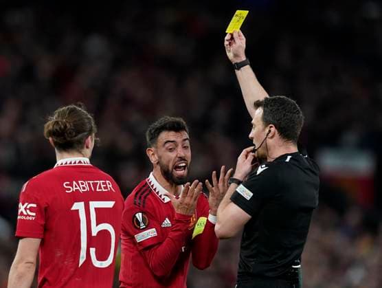 Manchester, England, 13th April 2023. Bruno Fernandes of Manchester United, ManU reacts to a yellow card which means he will miss the 2nd leg during the UEFA Europa League match at Old Trafford, Manchester. Picture credit should read: Andrew Yates Sportimage EDITORIAL USE ONLY. No use with unauthorised audio, video, data, fixture lists, club league logos or live services. Online in-match use limited to 120 images, no video emulation. No use in betting, games or single club league player publications. SPI-2367-0042