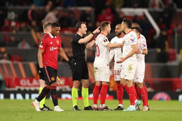 Mandatory Credit: Photo by Ryan Browne Shutterstock (13867464bg) Referee Mr Felix Zwayer ushers away Sevilla players at half time. Manchester United, ManU v Sevilla, UEFA Europa League, Quarter-Final, First Leg, Football, Old Trafford, Manchester, UK - 13 Apr 2023 Manchester United v Sevilla, UEFA Europa League, Quarter-Final, First Leg, Football, Old Trafford, Manchester, UK - 13 Apr 2023 Copyright: xRyanxBrowne Shutterstockx 13867464bg