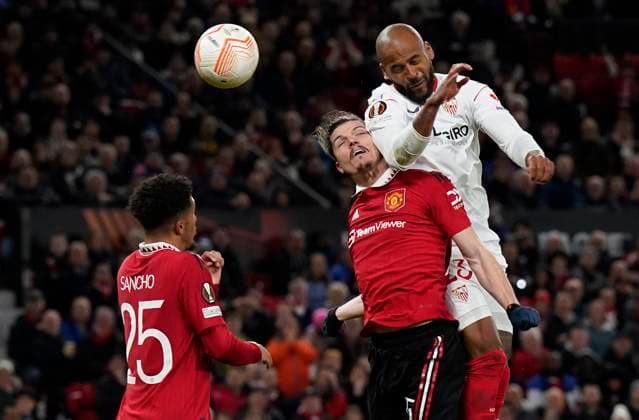Manchester, England, 13th April 2023. Marcao of Sevilla tussles with Marcel Sabitzer of Manchester United, ManU and gets a header towards goal during the UEFA Europa League match at Old Trafford, Manchester. Picture credit should read: Andrew Yates Sportimage EDITORIAL USE ONLY. No use with unauthorised audio, video, data, fixture lists, club league logos or live services. Online in-match use limited to 120 images, no video emulation. No use in betting, games or single club league player publications. SPI-2367-0044