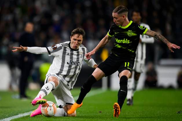 Juventus FC v Sporting CP - UEFA Europa League Federico Chiesa of Juventus FC competes for the ball with Nuno Santos of Sporting CP during the UEFA Europa League quarterfinal first leg football match between Juventus FC and Sporting CP. Turin Italy Copyright: xNicolòxCampox