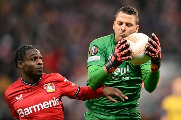 LEVERKUSEN, GERMANY - APRIL 13 : Moris Anthony goalkeeper of Union St-Gilloise battles for the ball with Frimpong Jeremie defender of Bayer Leverkusen during the UEFA Europa League Quarter-finals, 1st leg match between Leverkusen and Union SG at the BayArena on April 13, 2023 in Leverkusen, Germany, 13 04 2023 ( Leverkusen v Union SG - UEFA Europa League PhotoNews Panoramic 